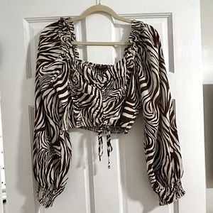 Brown and tan zebra print long sleeve crop top